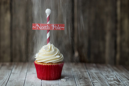 Christmas North Pole cupcake with a dusting of powdered sugarの写真素材
