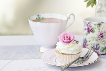 Afternoon tea served with a rose cupcakeの写真素材
