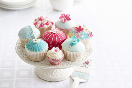 Afternoon tea served with a variety of cupcakesの写真素材