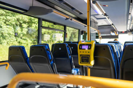 Interior of a bus with a self-service ticketing systemの写真素材