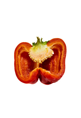 Red bell pepper cut in half isolated on white background. Close up.の写真素材