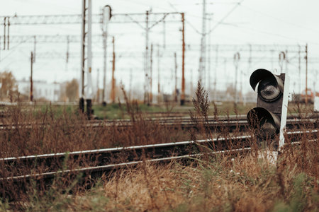 old broken railway light signal (traffic light). with retro autumn backgroundの写真素材