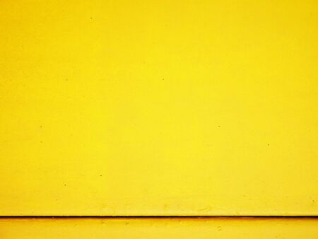 Yellow cement wall background.の写真素材