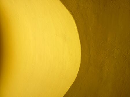 Yellow cement wall background.の写真素材