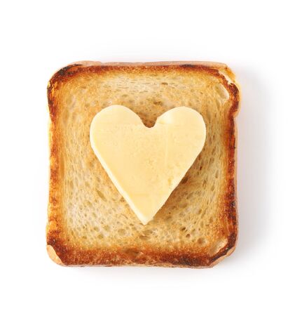 heart shaped butter on toasted bread isolated on white background, top viewの写真素材