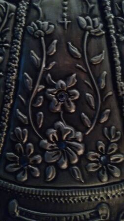 Embossed metal texture with flowersの写真素材
