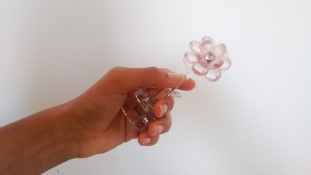 Hand giving crystal flowerの写真素材