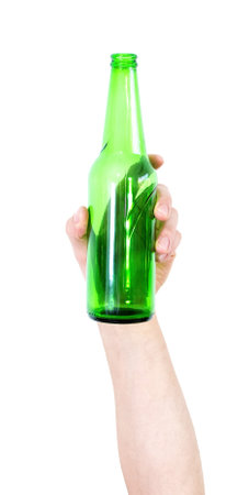 Male hand holding bottles of beer up at party giving a cheers isolated on white background.の写真素材