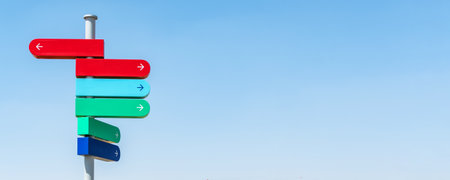 Blank sign post against blue sky.の写真素材