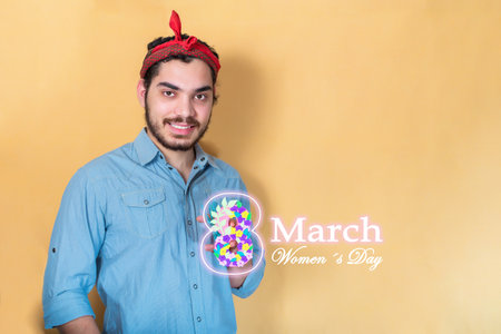 Young man celebrating International Women's Day.の写真素材