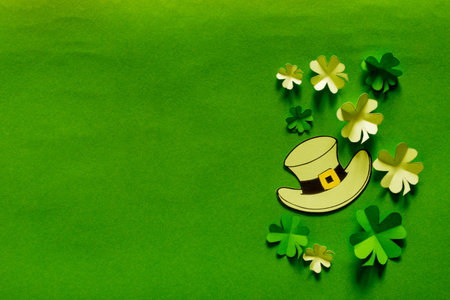 Saint Patrick's day background with hat and paper clovers. top view. Copy textspace.の写真素材