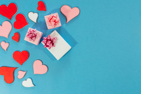 Love hearts and gifts on blue background. Valentines day card concept. Heart for Valentines Day Background. Select focus. Soft focus. top view.の写真素材