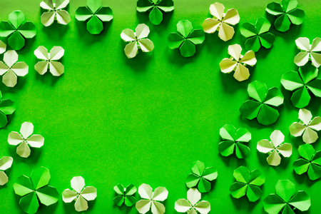 Saint Patrick's day background with origami clovers leaves. Paper origami clovers. top view. copy textspace.の写真素材