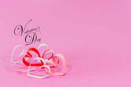 Paper Love hearts on pink background. Valentines day card concept. mother's day concept Background. Select focus. Soft focus.の写真素材
