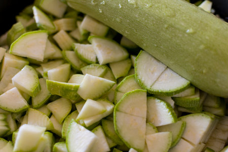 Close up of whole and chopped zucchini, on wooden background. Select focus. Soft focus. top view.の写真素材