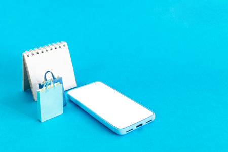 Shop store smart phone, Shopping bag and calendar sale.の写真素材