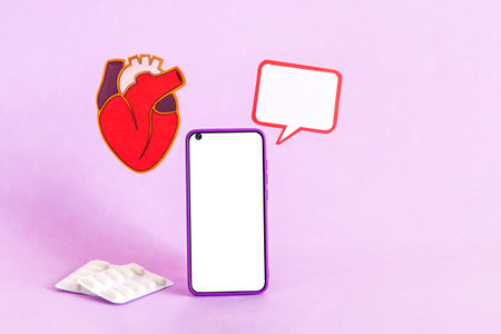 Smart phone and heart health insurance, world heart day, world health day.の写真素材