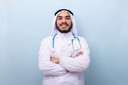 Arabian male doctor, smiling and looking at camera.の写真素材