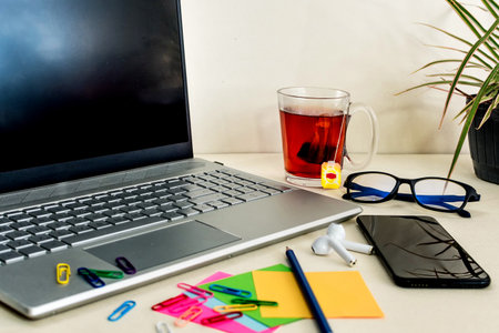 View of office desk with small note paper, laptop and office supplies. business background conceptの写真素材