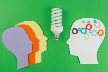 Brainstorming, communications, solutions. Silhouettes of heads with gears communicating with each other. Managing ideas. Effective leadership.の写真素材
