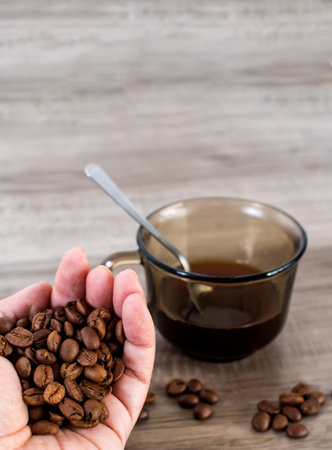 Hands holding coffee beans.の写真素材