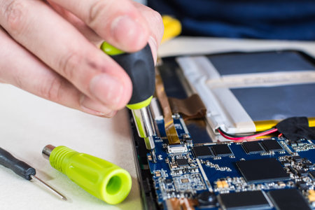 close up image of smart phone and tablet repair, in technology lab.の写真素材