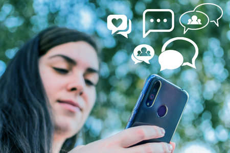 Social media or network on smart phone, comments, likes and new followers, communication online.の写真素材