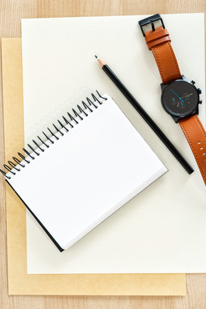 Diary book blank page on wood desk on top.