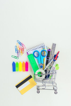 Shopping cart with school supplies. Back to school. Online shopping.の写真素材