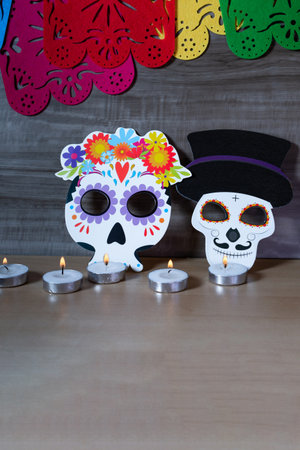 Paper cut sugar skull decoration on wooden background.の写真素材