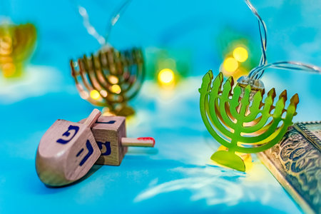 Close up of dreidel and yellow Hanukkah menorah. still lifeの素材