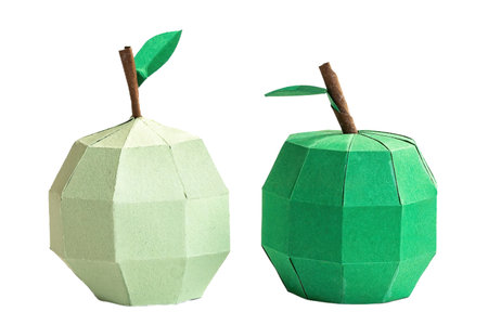 Green apple figures in paper craft, isolated on white or transparent background cutout.の写真素材