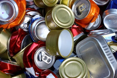 A bunch of crushed alumnium cans all together for recycling to help be green for the Earth and to be enviromentaly friendlyの写真素材