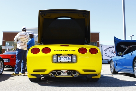 GLOUCESTER, VA- OCTOBER 13:Back of a yellow Corvette at the Ken Houtz Chevrolet Buick, Camaro VS Corvette Humane Society car show and food drive in Gloucester, Virginia on October 13, 2012のeditorial素材