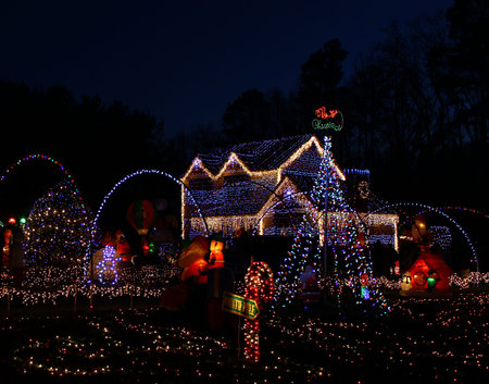 A Home decorated and lighted with 650,000 lights and over 60 inflatables for Christmas and for New Year Eve at Night in Virginiaのeditorial素材