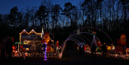 A Home decorated and lighted with 650,000 lights and over 60 inflatables for Christmas and for New Year Eve at Night in Virginiaのeditorial素材