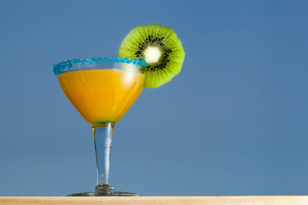 Orange and Kiwi Cocktail. Blue sky backgroundの写真素材
