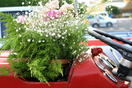  red car with flowers in the street.の写真素材