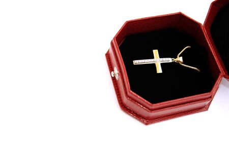 Golden and diamond cross and chain in the jewelery box.の写真素材