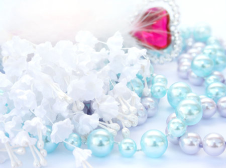 Celebration card with white flowers,pearls,red heart.の写真素材