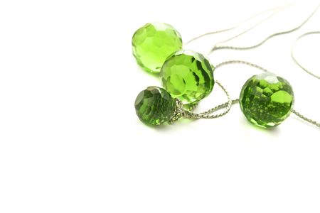Necklace with transparent green beads on white background.の写真素材