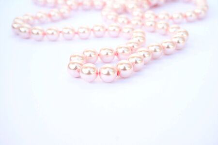 Pink pearl necklace on gray background.の写真素材