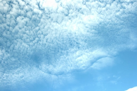 White fantastic clouds in blue sky.