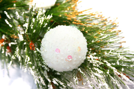 Christmas ball on fir tree isolated on white background.の写真素材