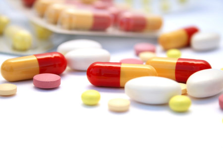 Medical pills and tablets isolated on white background.