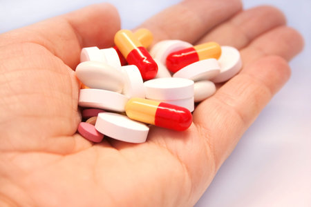 Medical pills on the hand.