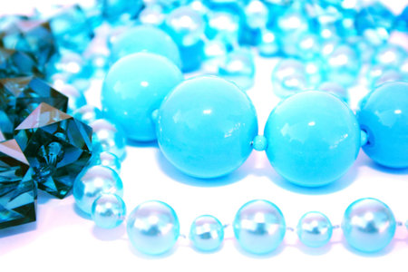 Blue beads necklace isolated on white background.の写真素材