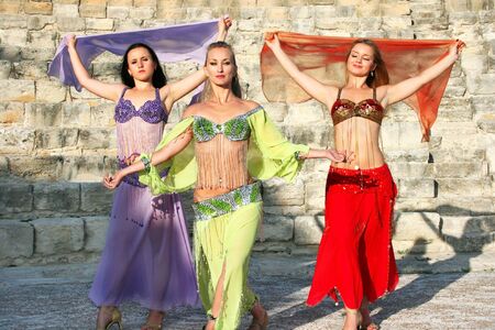 Beautiful belly dancers  on the ancient stairs of Kourion amphitheatre in Cyprus.の写真素材