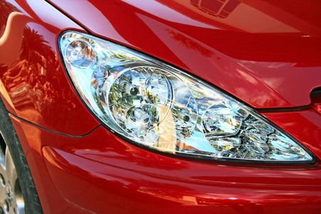 Red car luxurious headlights.の写真素材