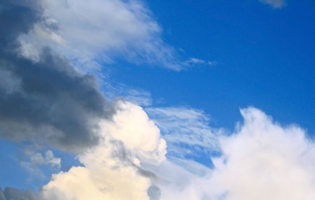 White and gray clouds in blue sky.
